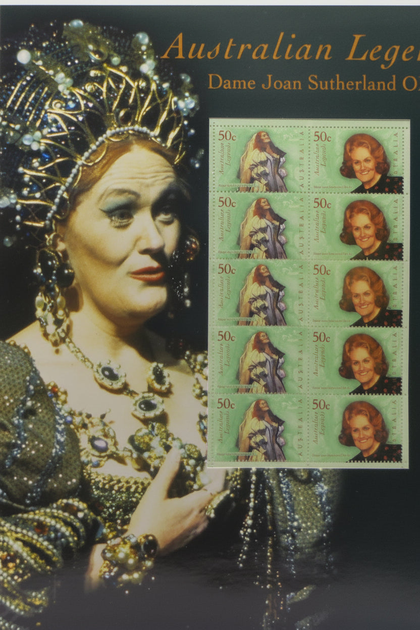 Collectible item featuring Dame Joan Sutherland with Australian Legends stamps on a textured surface.