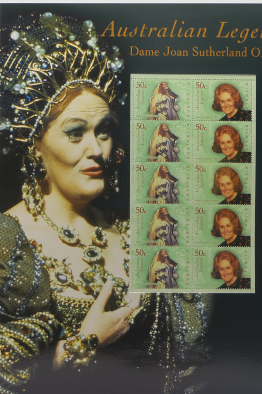 Collectible item featuring Dame Joan Sutherland with Australian Legends stamps on a textured surface.