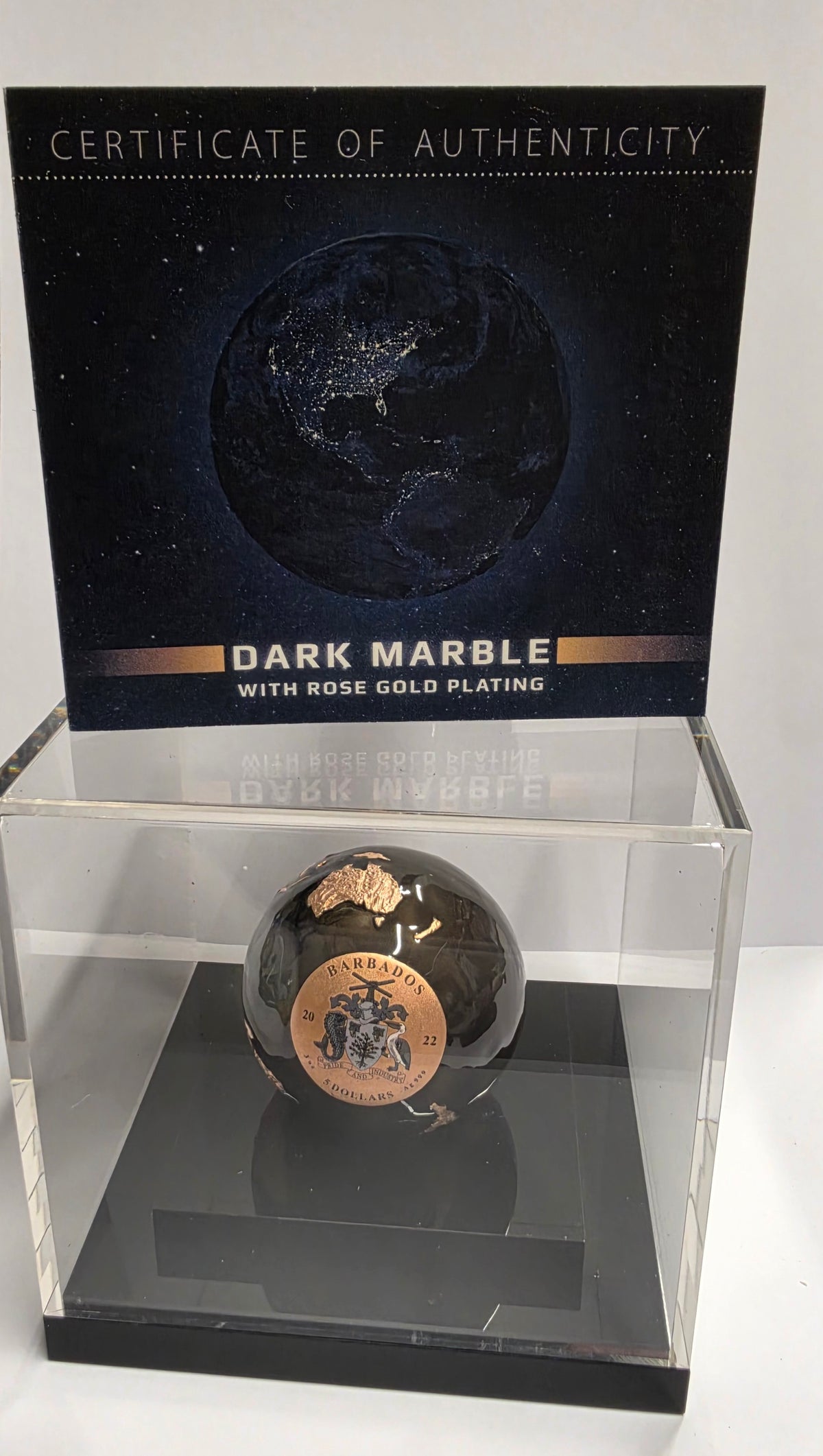 2022 Barbados 5 Dollars "Dark Marble" (Pangea Blue Marble / Earth at Night) Spherical Coin plated in 24k rose gold with translucent enamel and a 3 oz .999 pure silver core.