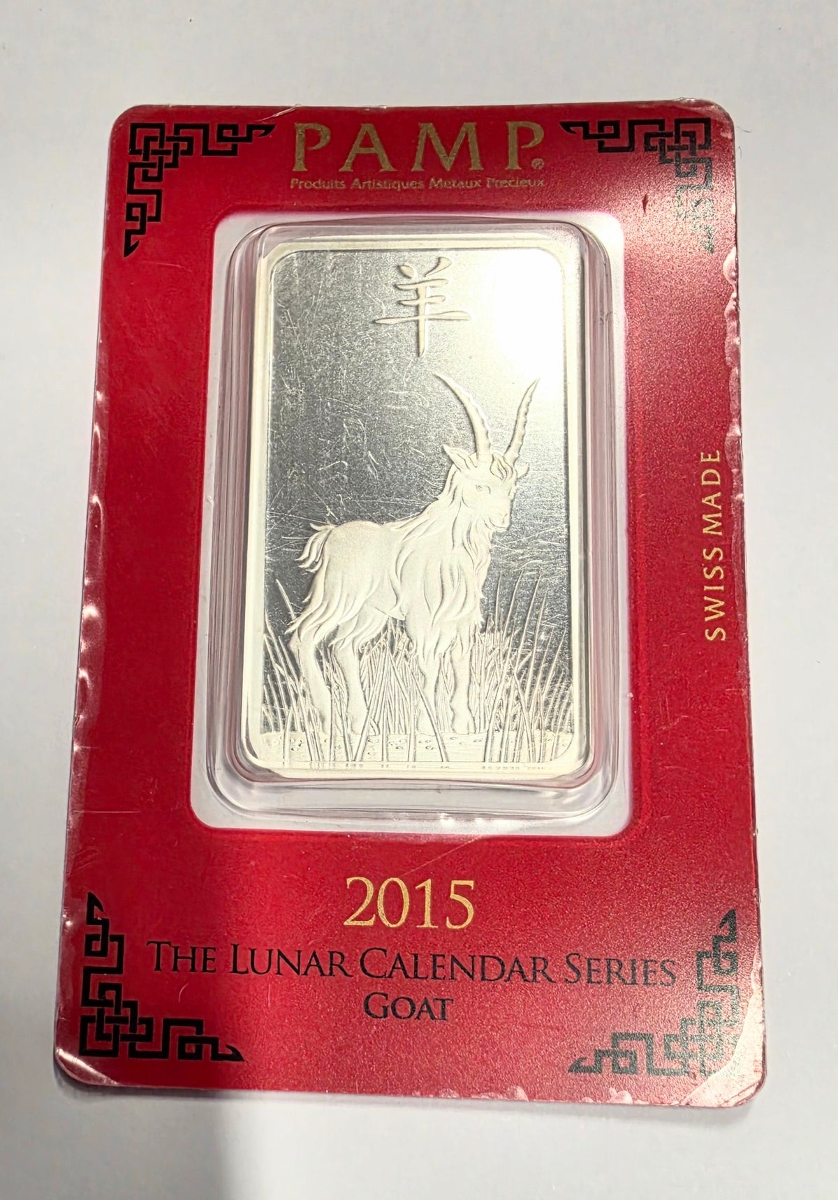 2015 PAMP Suisse Lunar Calendar Series "Year of the Goat" silver bar sealed in an assay card.