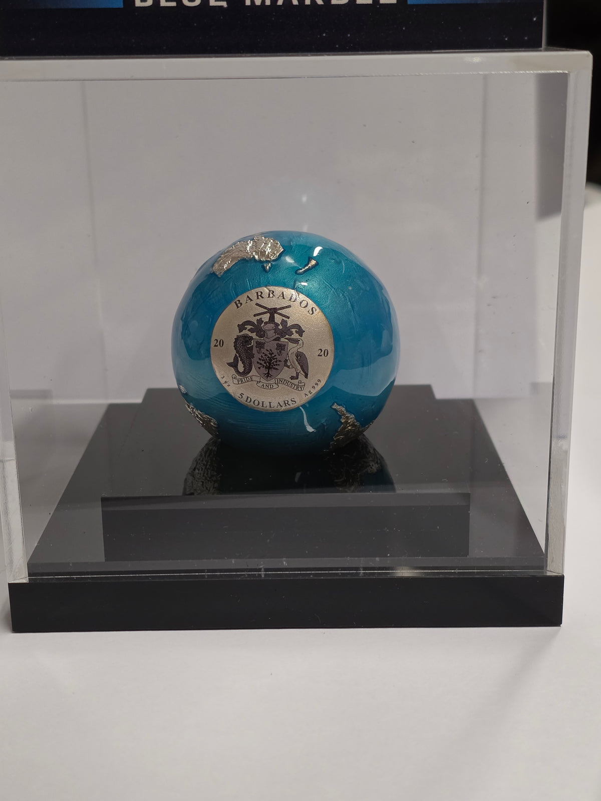 2022 5 Dollars "Blue Marble" Spherical silver coin issued by Barbados.